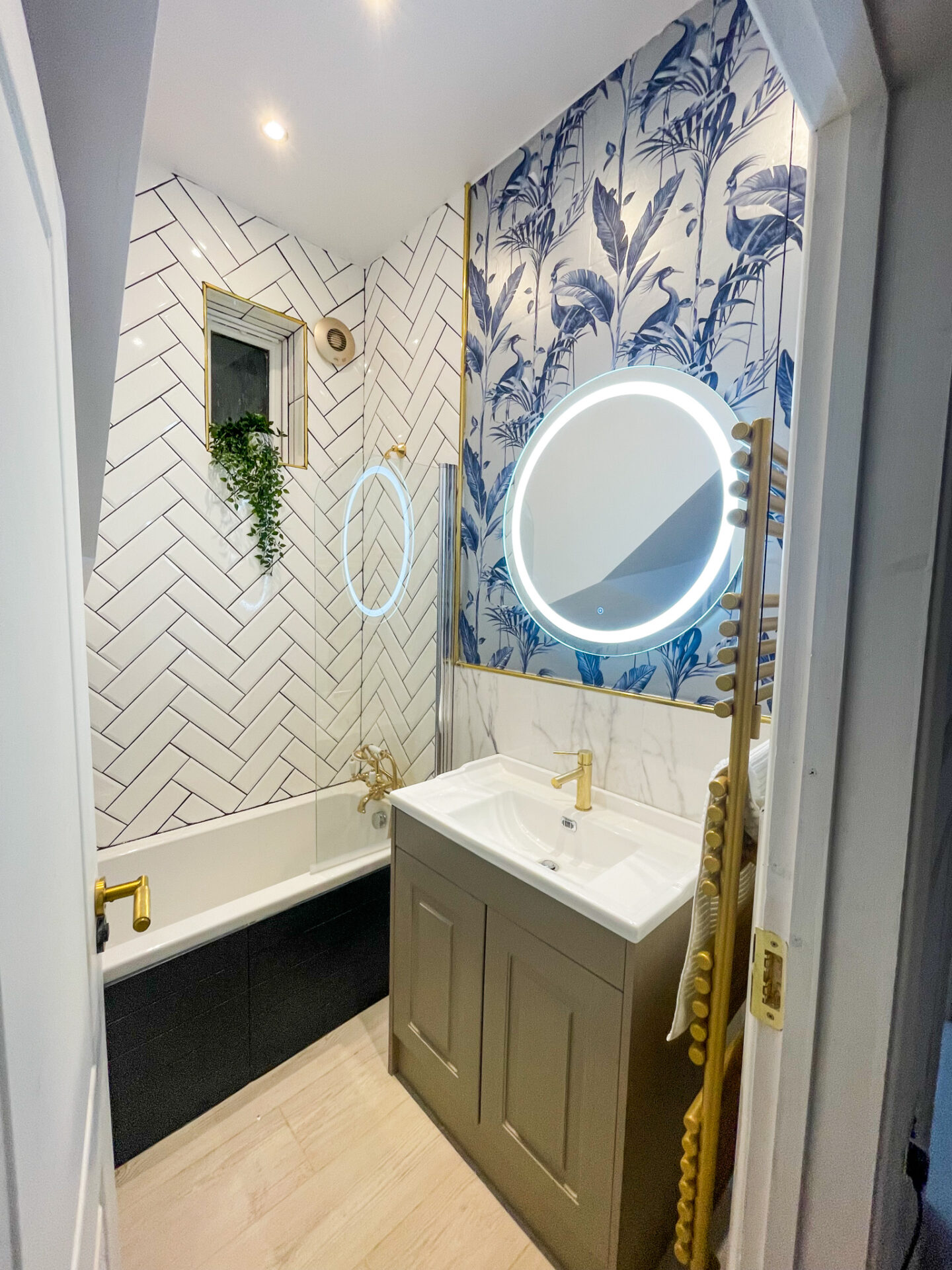 Small, navyblue, grey and white bathrooom